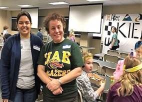 Dr. Sisiopiku and a volunteer at the 2019 Kids in Engineering Day.
